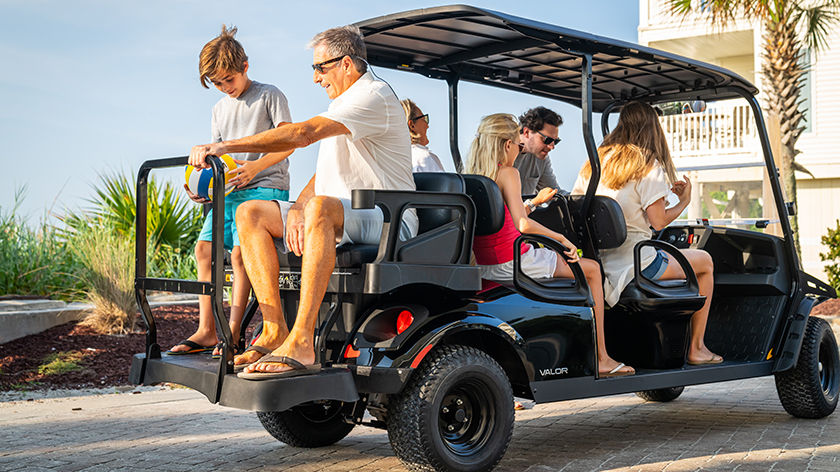 A large family aboard an E-Z-GO Valor 6.