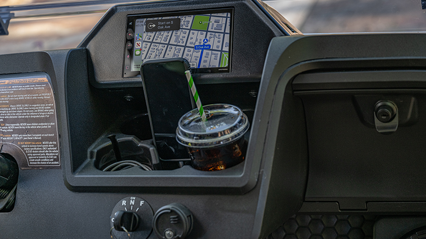 Close up of the dash and entertainment system on an E-Z-GO vehicle.