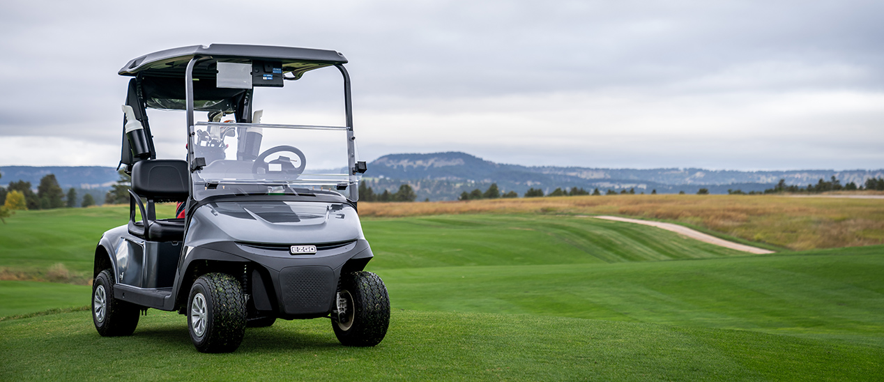 E-Z-GO RXV Fleet model sitting on a golf course